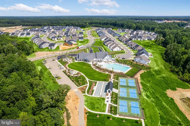 an aerial view of a house with a garden