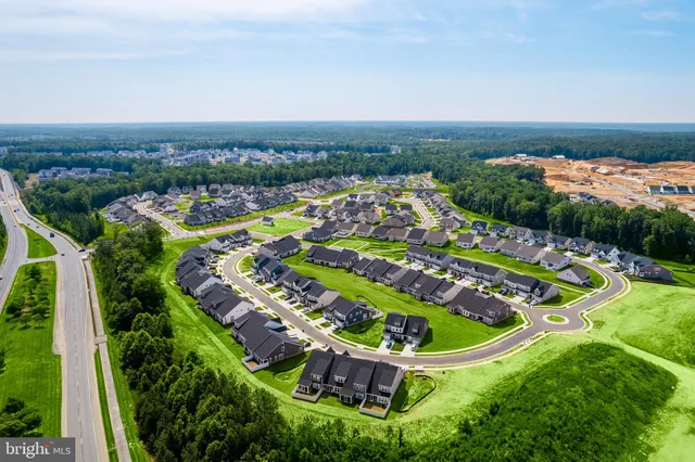 an aerial view of a pool yard patio kitchen and outdoor seating