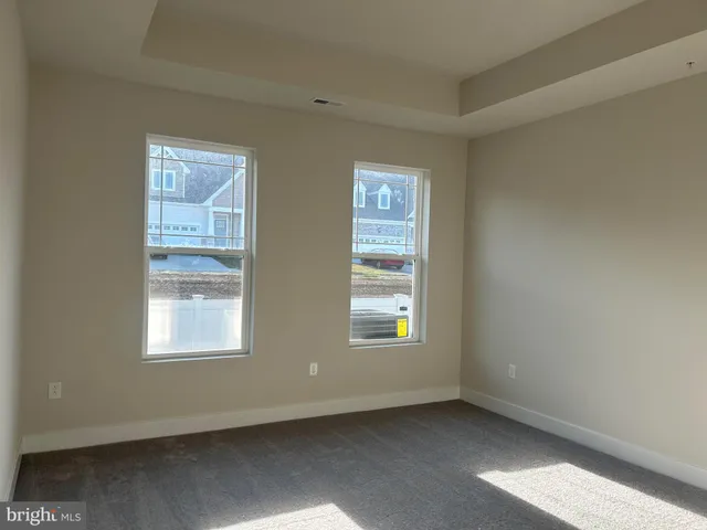 a bathroom with a granite countertop double vanity sink and a mirror