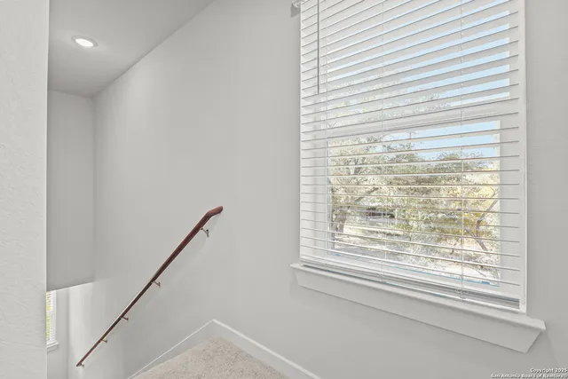 a view of a room that has a window in it