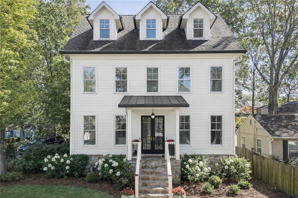 front view of a house with a yard