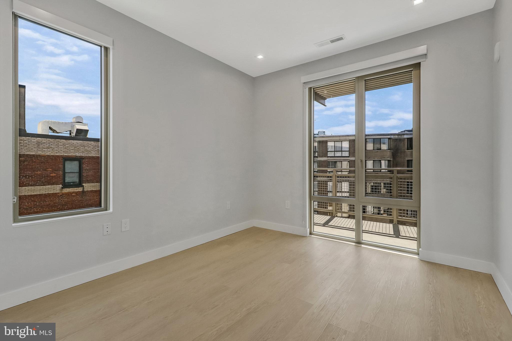 1224 M Street Northwest, Unit 404 Washington, DC 20005 - Photo 2 of 5 a view of an empty room with a window