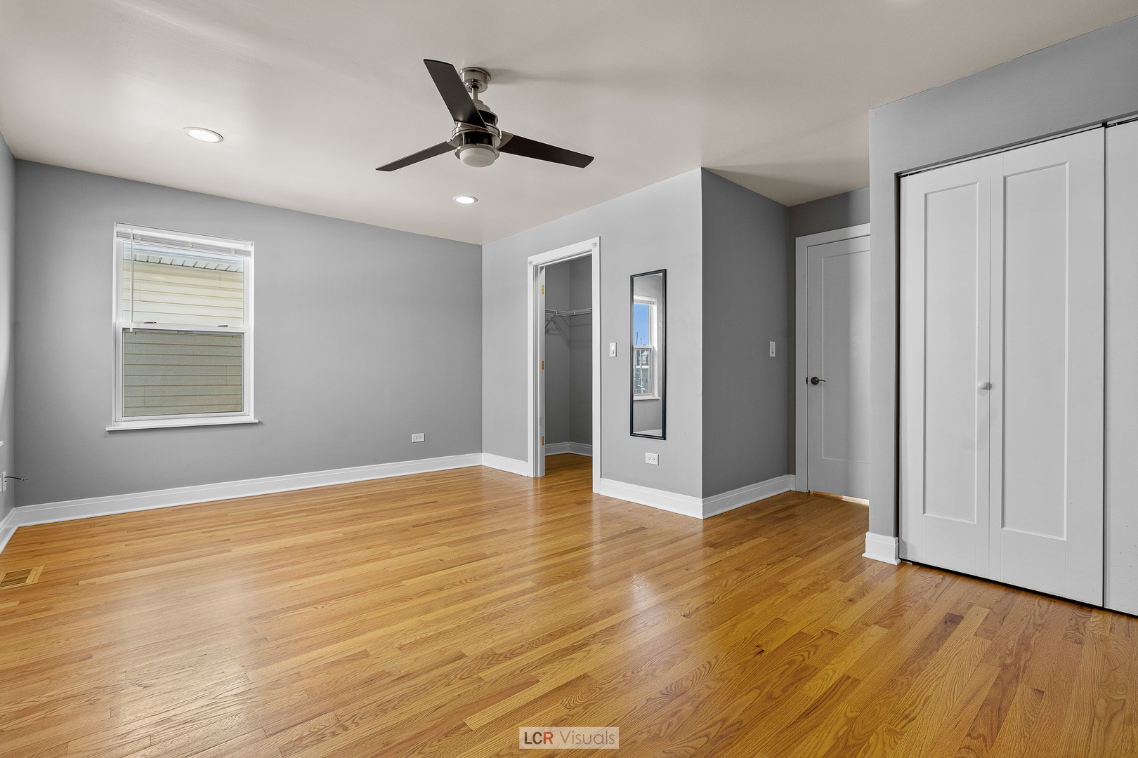 3422 West 13th Place Chicago, IL 60623 - Photo 12 of 15 a view of an empty room with wooden floor and a window