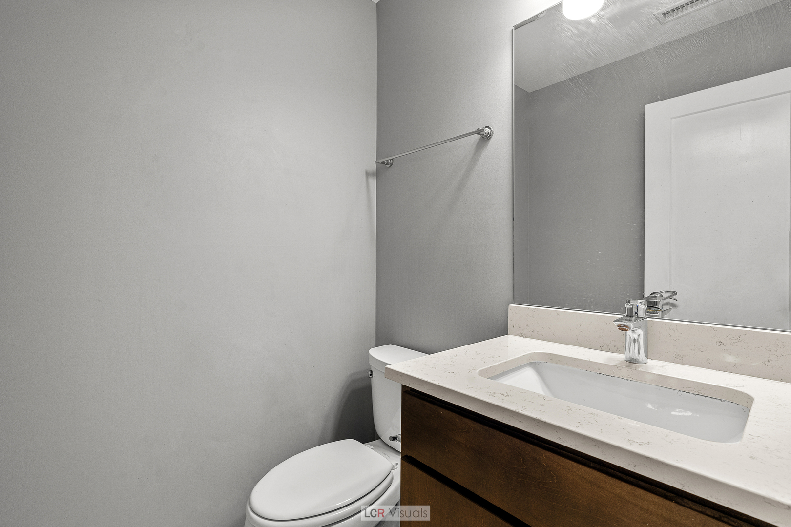 3422 West 13th Place Chicago, IL 60623 - Photo 5 of 15 a bathroom with a granite countertop toilet sink and mirror