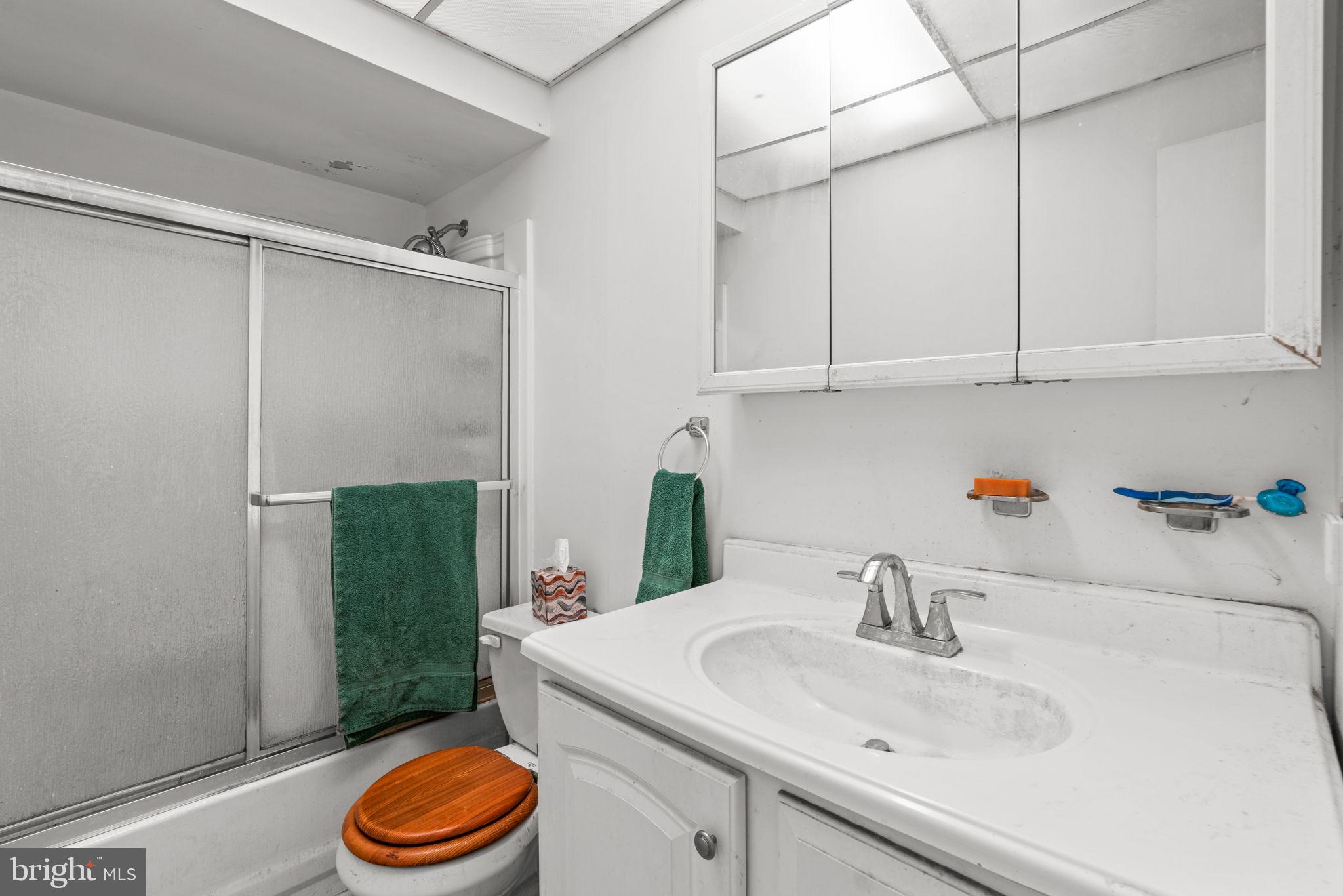 10390 May Wind Court Columbia, MD 21044 - Photo 22 of 29 a bathroom with a sink and a toilet