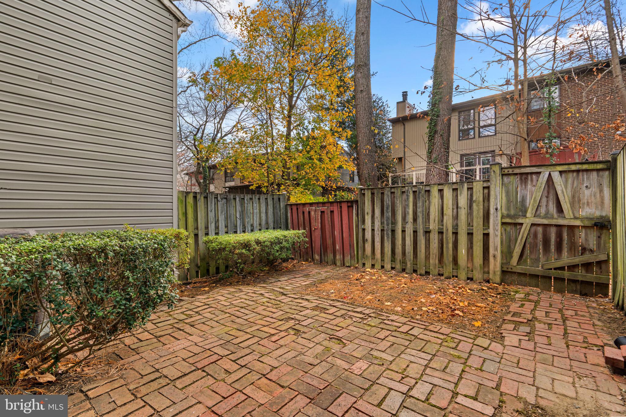 10390 May Wind Court Columbia, MD 21044 - Photo 24 of 29 a view of backyard with wooden fence