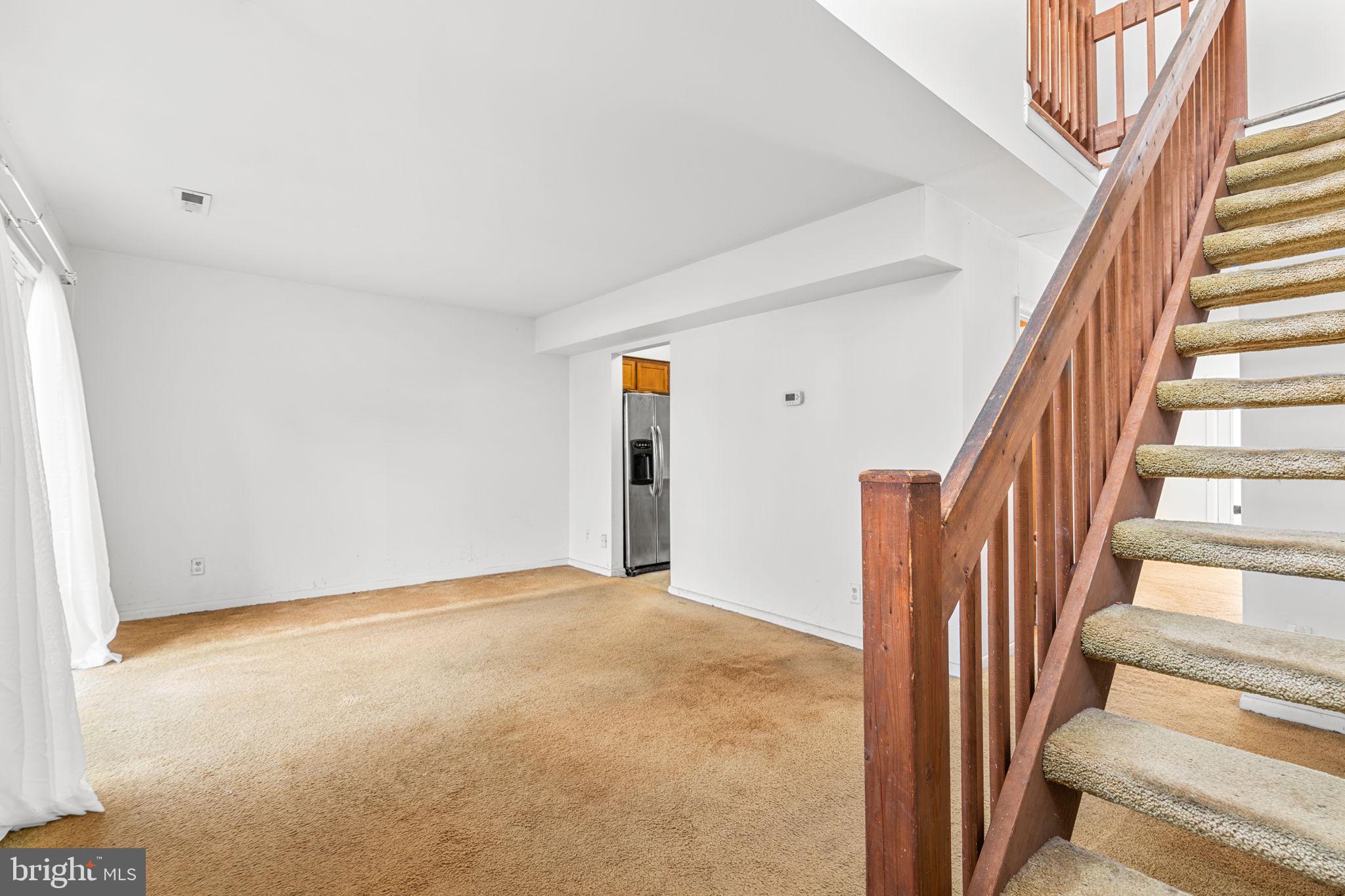 10390 May Wind Court Columbia, MD 21044 - Photo 4 of 29 a view of an entryway with staircase