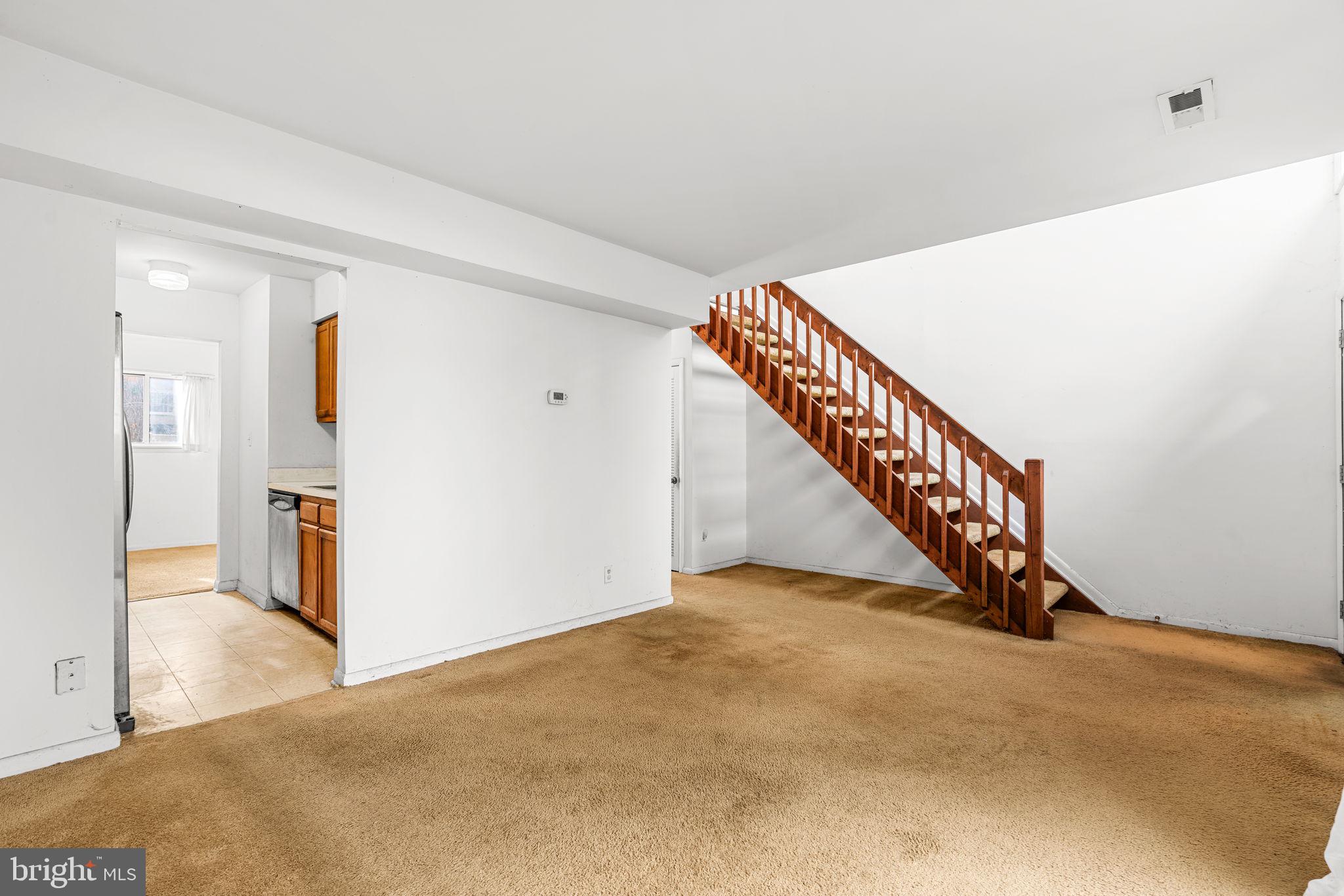 10390 May Wind Court Columbia, MD 21044 - Photo 5 of 29 a view of an entryway with stairs