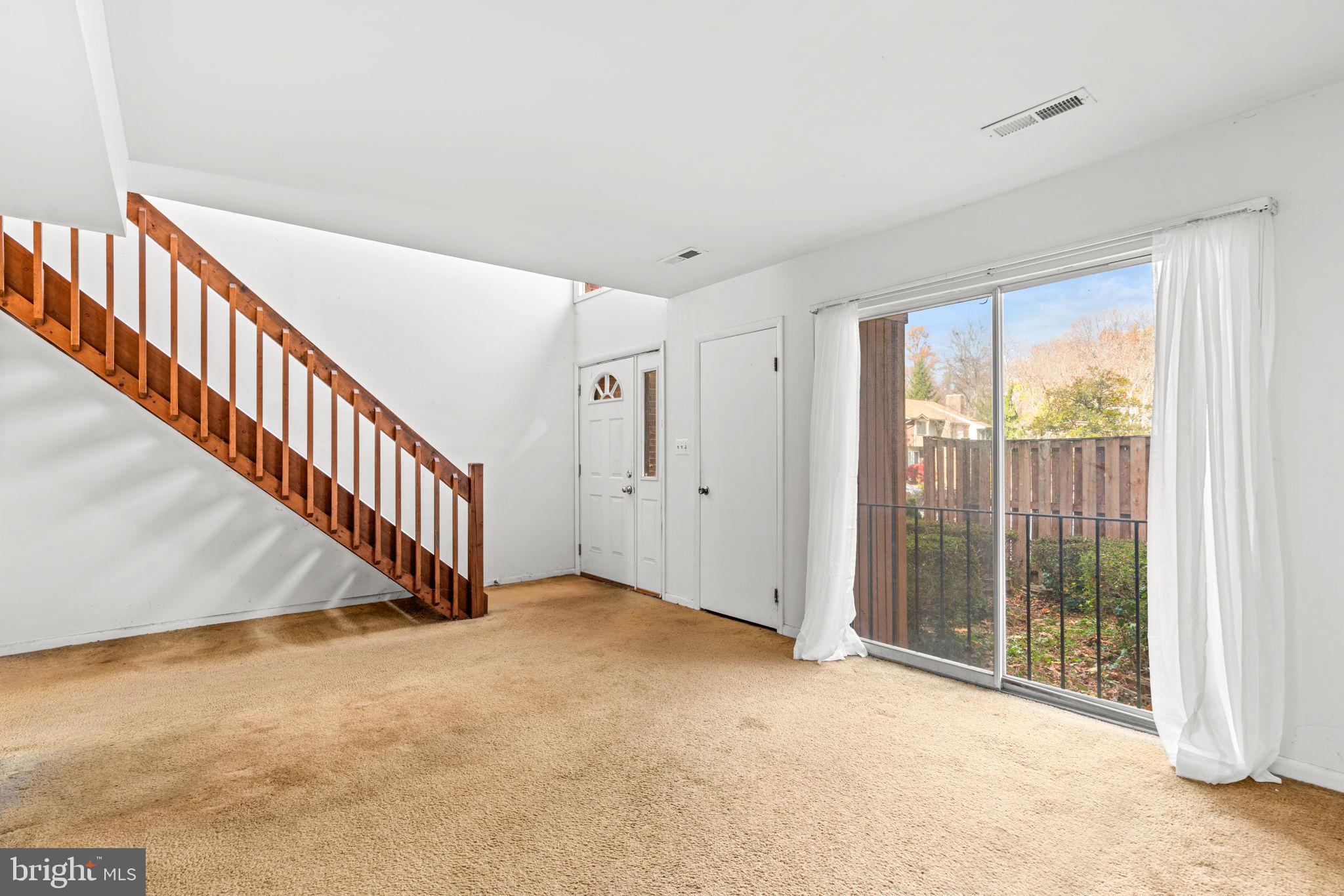 10390 May Wind Court Columbia, MD 21044 - Photo 6 of 29 a view of an entryway with wooden floor