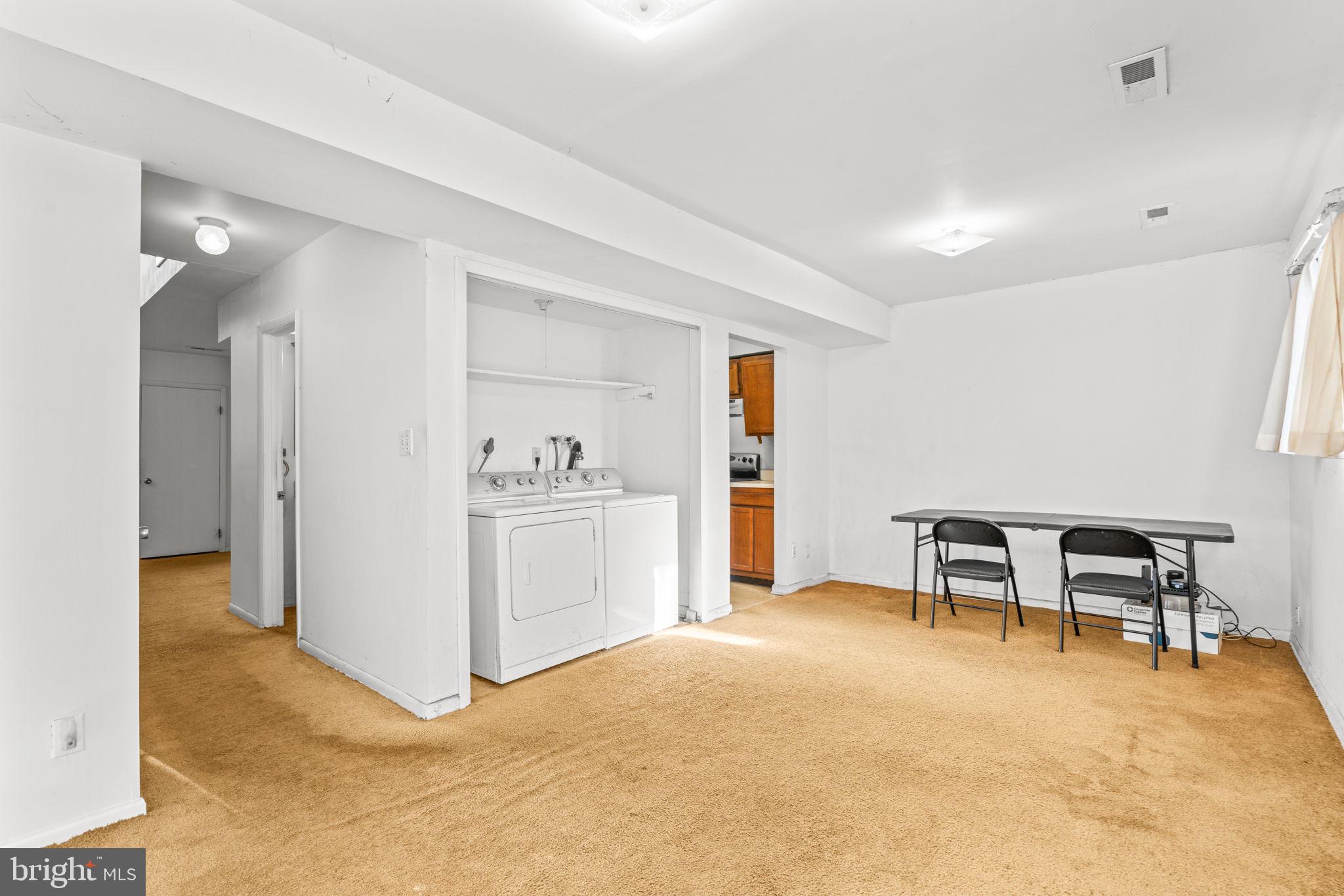 10390 May Wind Court Columbia, MD 21044 - Photo 9 of 29 a view of a livingroom with furniture and a workspace