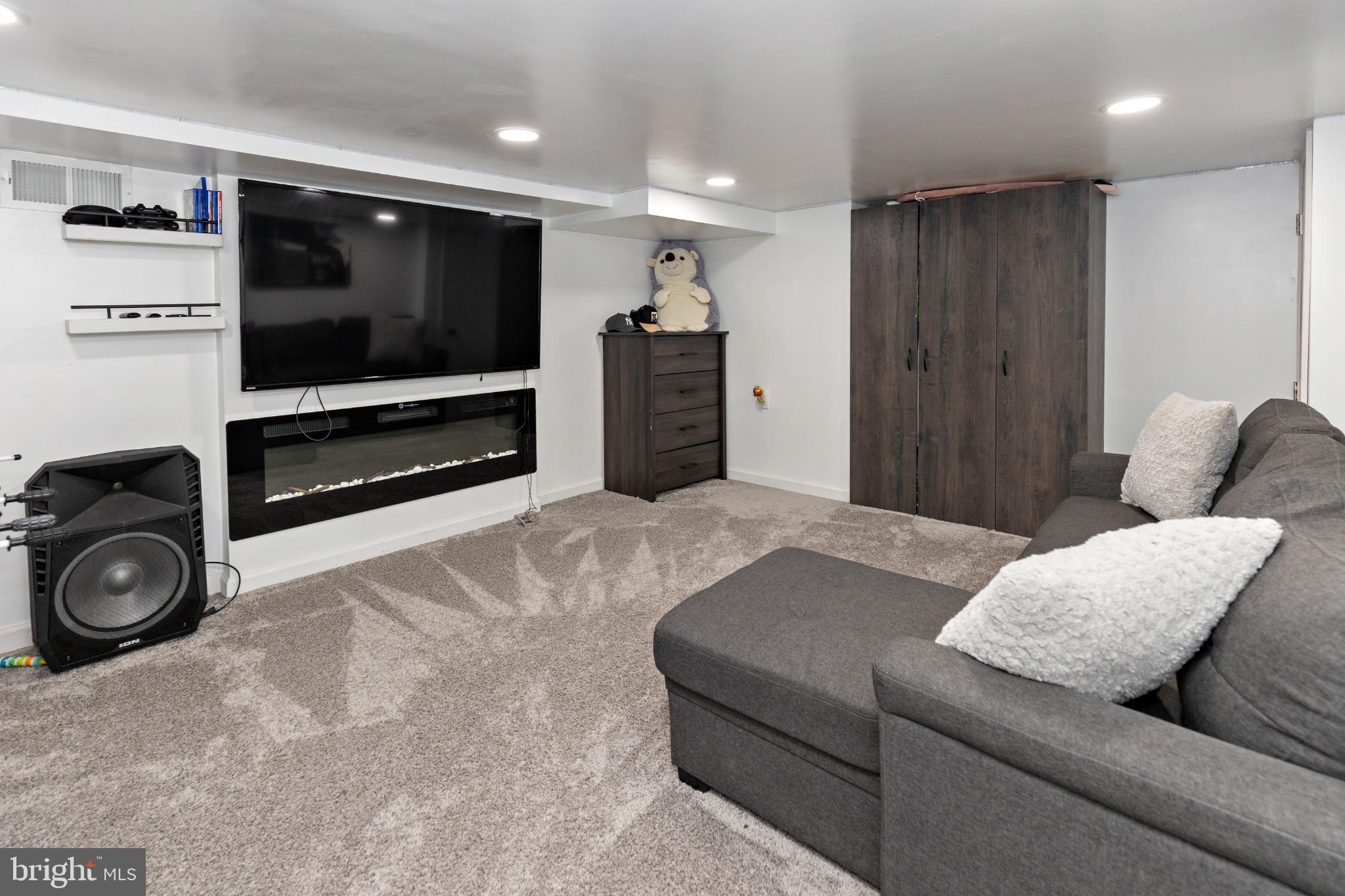 412 Horace Avenue Palmyra, NJ 08065 - Photo 17 of 24 a living room with furniture and a flat screen tv