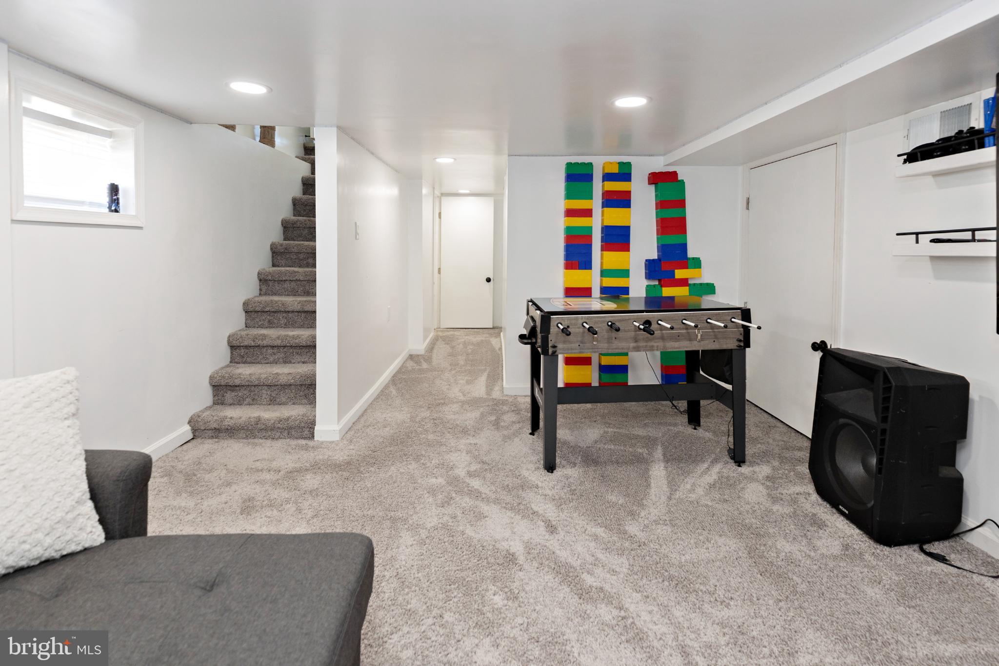 412 Horace Avenue Palmyra, NJ 08065 - Photo 18 of 24 a view of game room with stairs and wooden floor