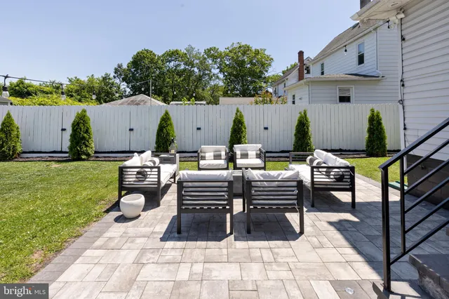 a outdoor space with the couches and a potted plant