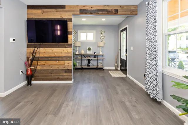 a view of room with furniture and wooden floor