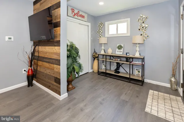 a view of entryway with wooden floor