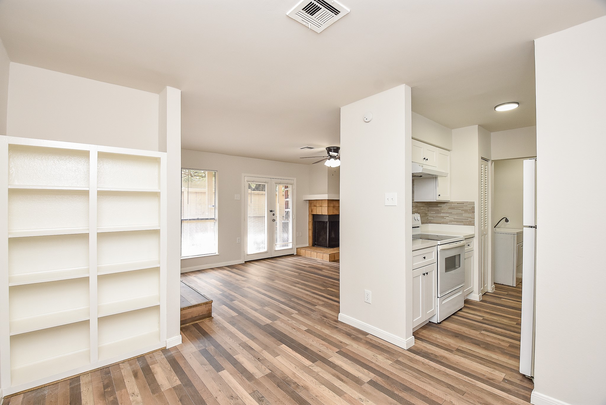 3644 Ocee Street Houston, TX 77063 - Photo 1 of 32 a kitchen with a refrigerator and white cabinets