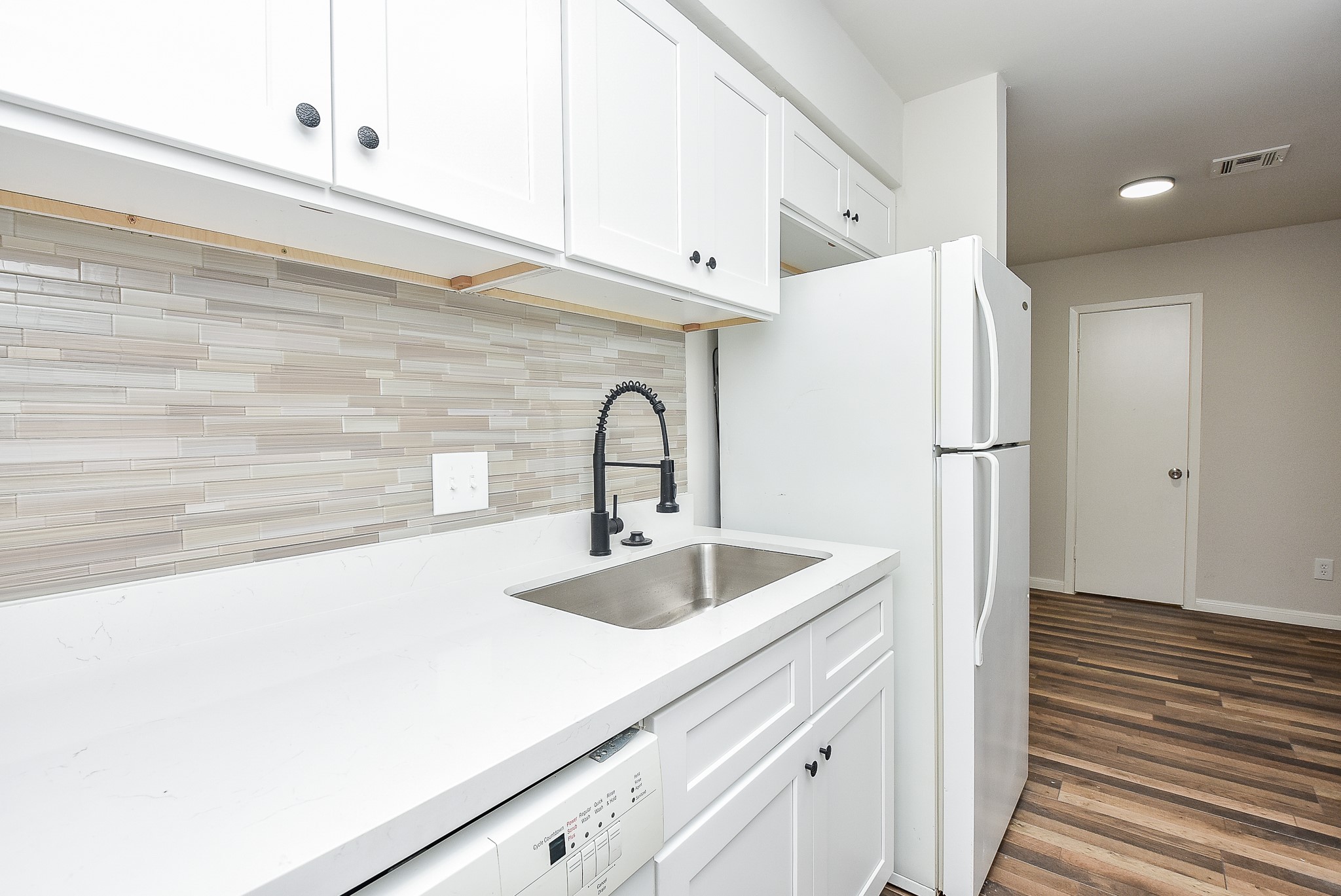 3644 Ocee Street Houston, TX 77063 - Photo 16 of 32 a kitchen with stainless steel appliances a sink and a refrigerator
