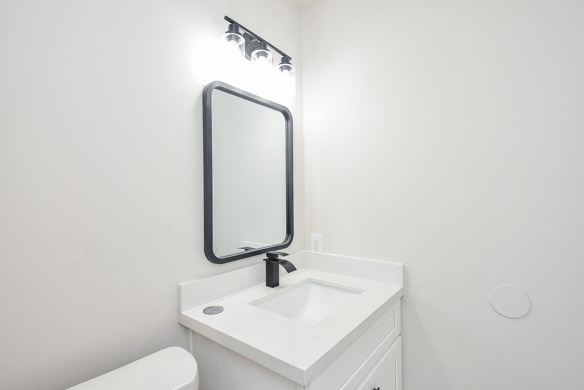 3644 Ocee Street Houston, TX 77063 - Photo 23 of 32 a bathroom with a sink vanity and toilet
