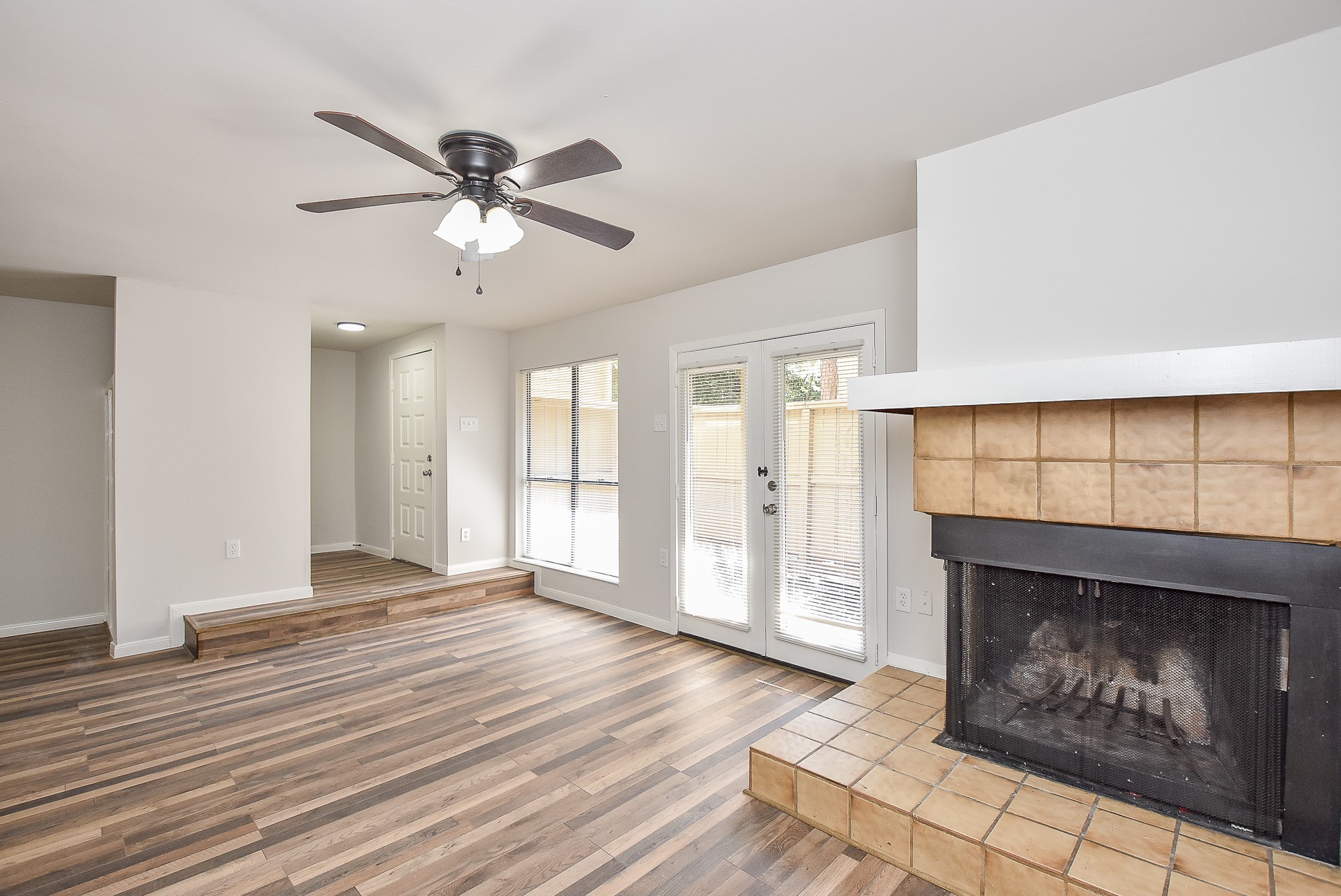 3644 Ocee Street Houston, TX 77063 - Photo 3 of 32 a view of an empty room with window and wooden floor