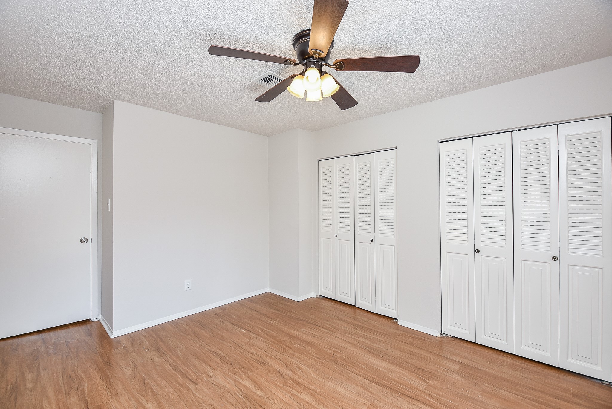 3644 Ocee Street Houston, TX 77063 - Photo 31 of 32 a view of an empty room with wooden floor