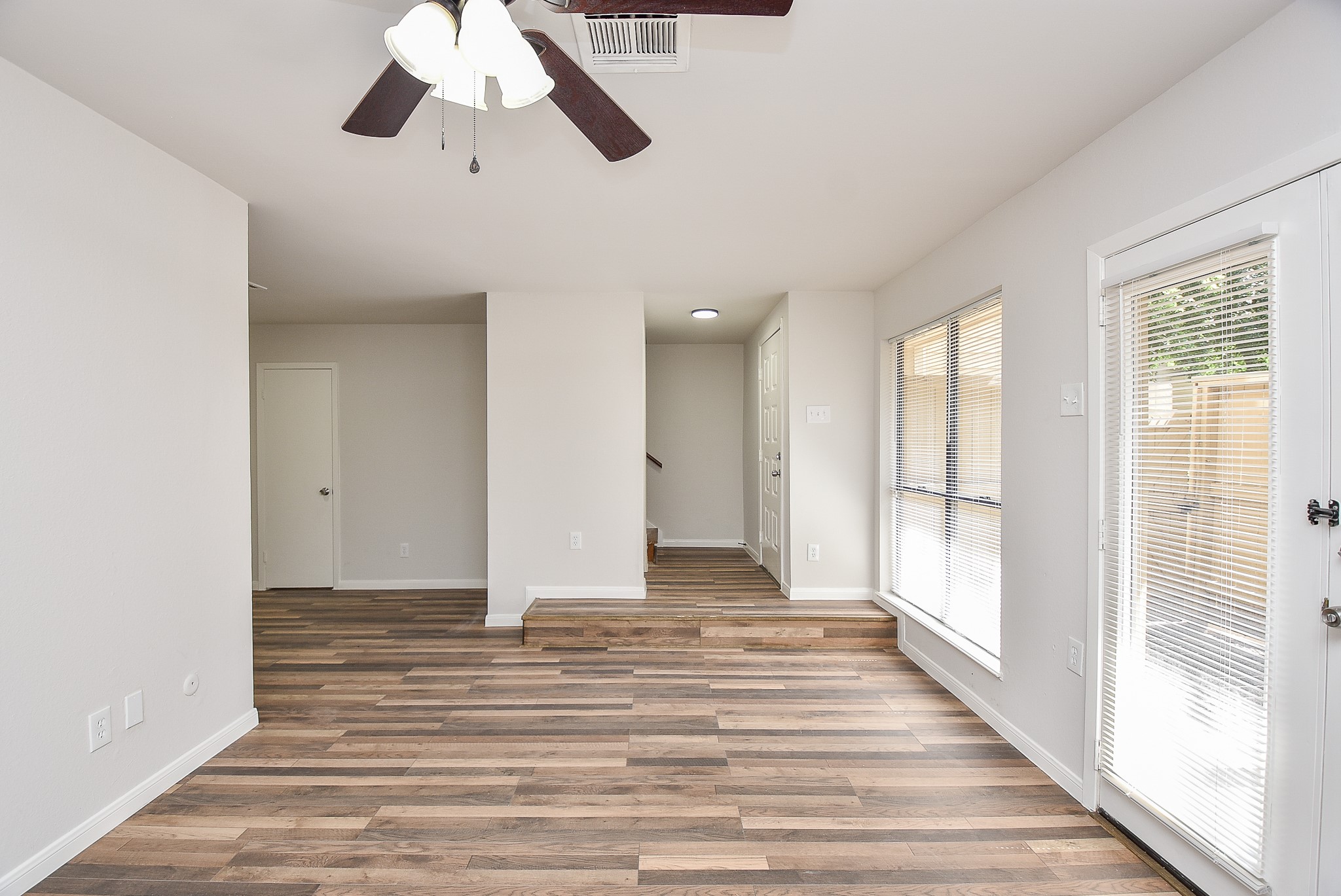 3644 Ocee Street Houston, TX 77063 - Photo 5 of 32 a view of a room with wooden floor and windows