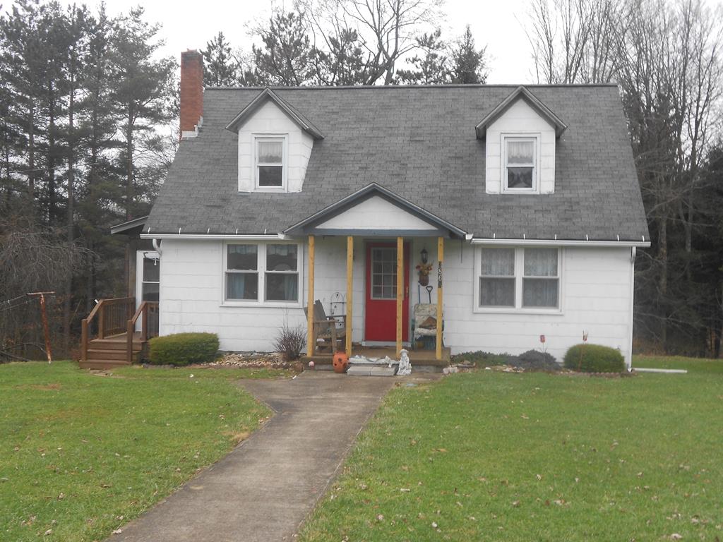 2863 Kinbahe Road Clarion, PA 16214 - Photo 1 of 11 a front view of a house with a yard and trees