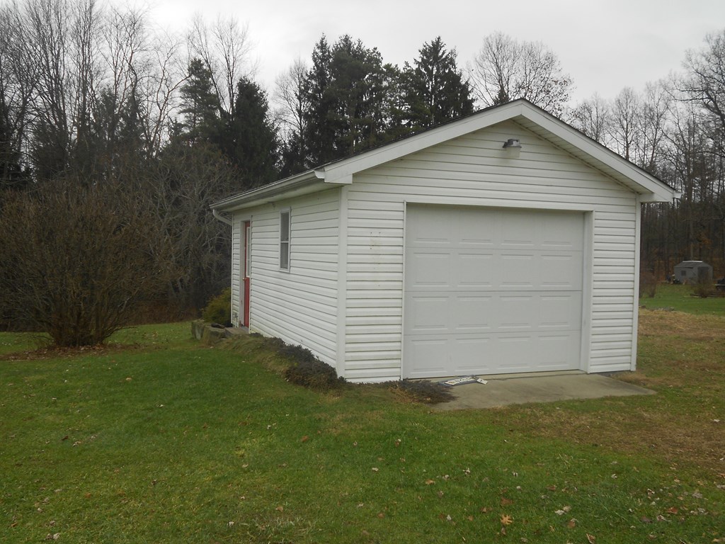 2863 Kinbahe Road Clarion, PA 16214 - Photo 2 of 11 a small white house with a small yard
