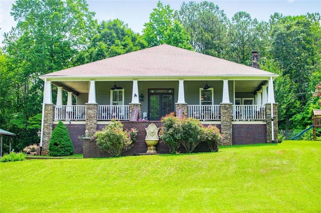 a front view of a house with garden