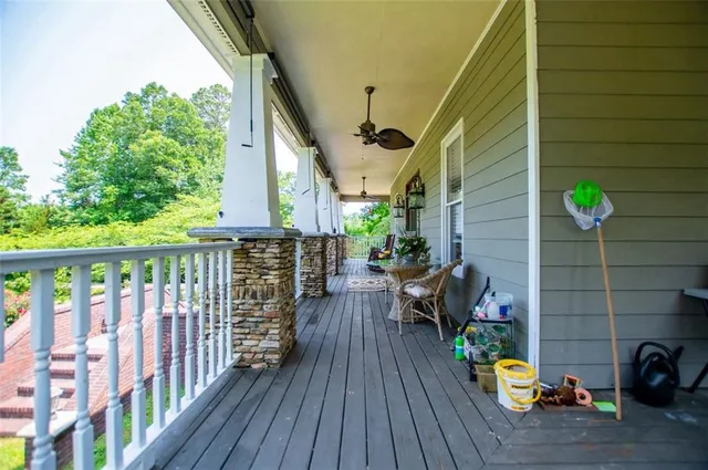 a kitchen with a refrigerator a stove top oven a sink dishwasher and wooden cabinets with wooden floor