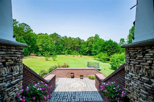 a kitchen with stainless steel appliances granite countertop wooden cabinets a stove top oven a sink and dishwasher
