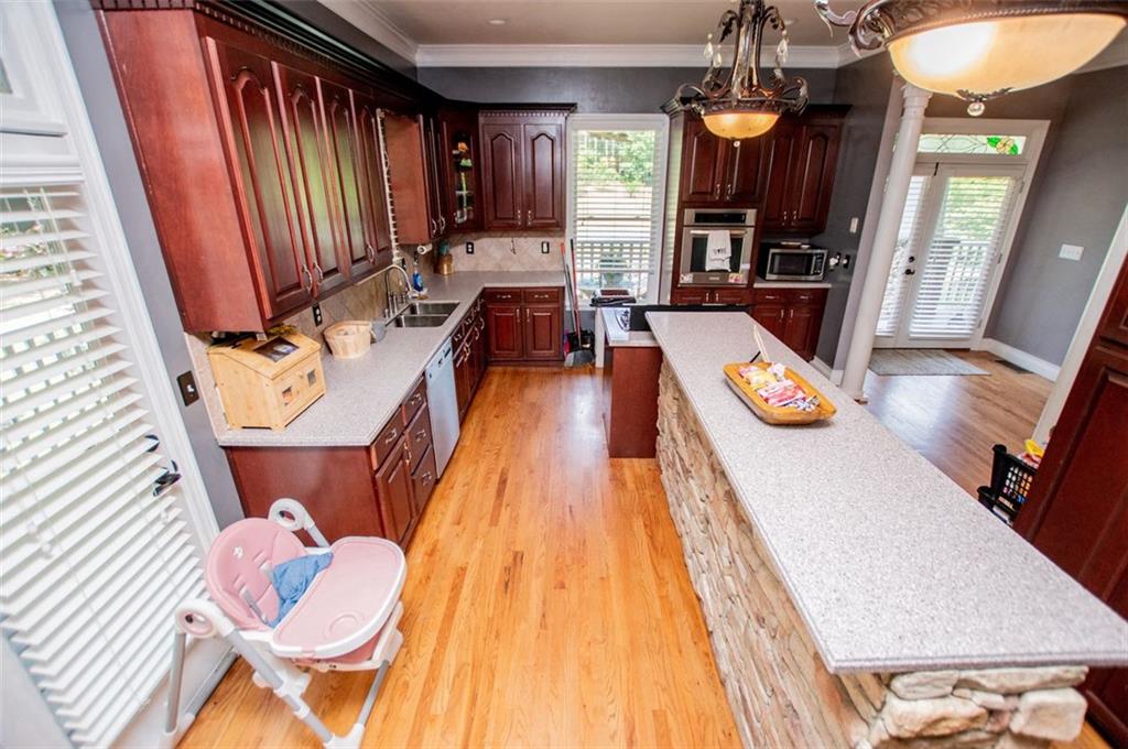 6919 Mt Zion Road Waco, GA 30182 - Photo 23 of 79 a living room with furniture and a flat screen tv