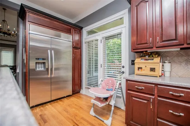 a living room with fireplace furniture and a flat screen tv