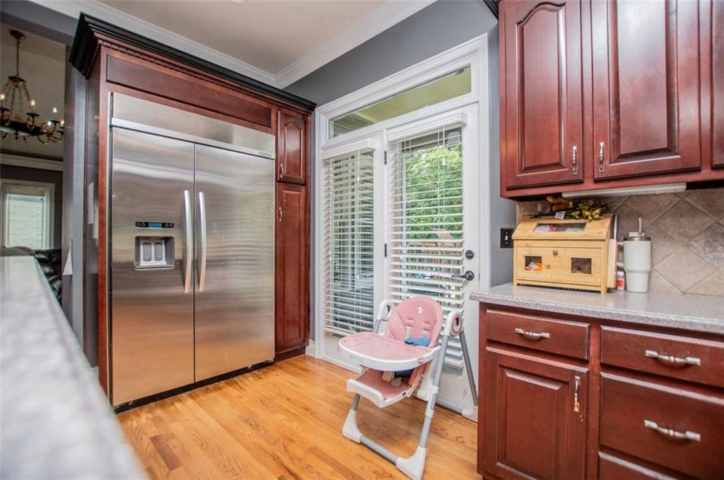 6919 Mt Zion Road Waco, GA 30182 - Photo 26 of 79 a kitchen with stainless steel appliances granite countertop a refrigerator and a sink