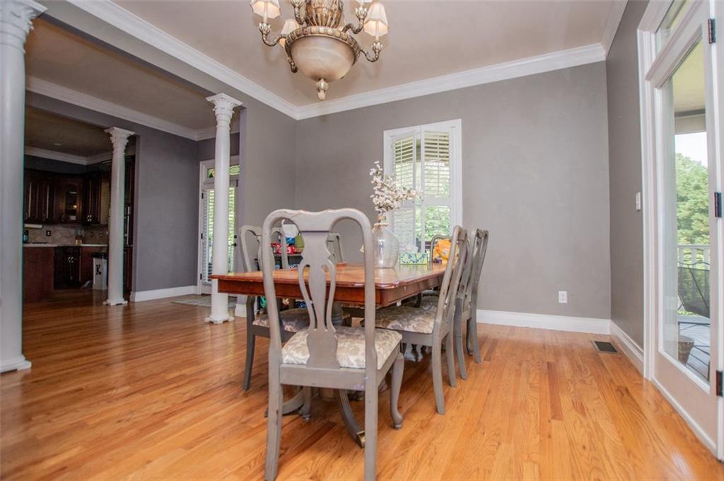 6919 Mt Zion Road Waco, GA 30182 - Photo 36 of 79 a view of a dining room with furniture window and wooden floor
