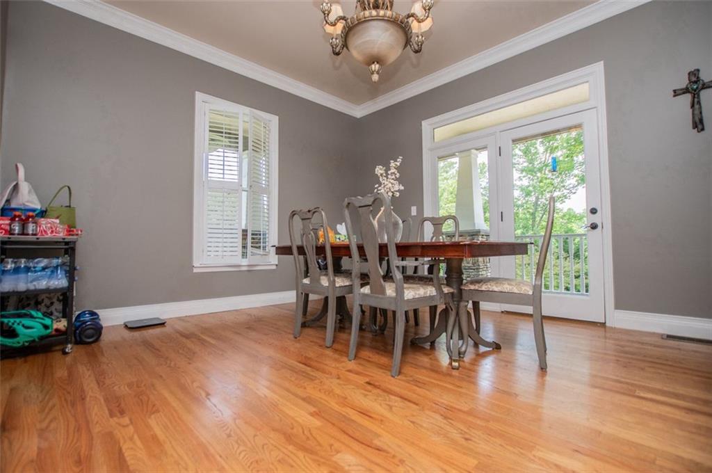 6919 Mt Zion Road Waco, GA 30182 - Photo 37 of 79 a view of a dining room with furniture window and wooden floor