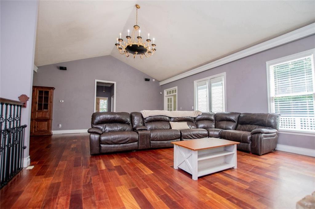 6919 Mt Zion Road Waco, GA 30182 - Photo 39 of 79 a living room with furniture and a wooden floor