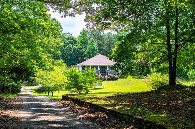 a view of a swimming pool with an outdoor space and seating area