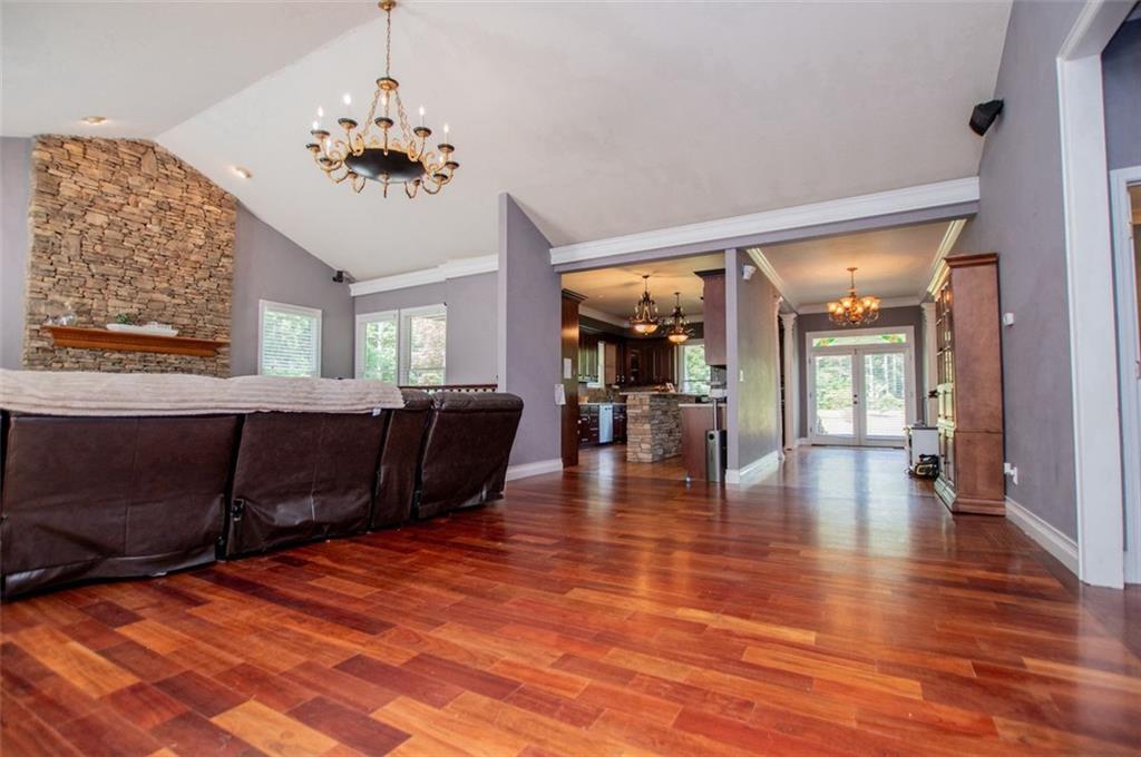 6919 Mt Zion Road Waco, GA 30182 - Photo 43 of 79 a living room with furniture and a chandelier