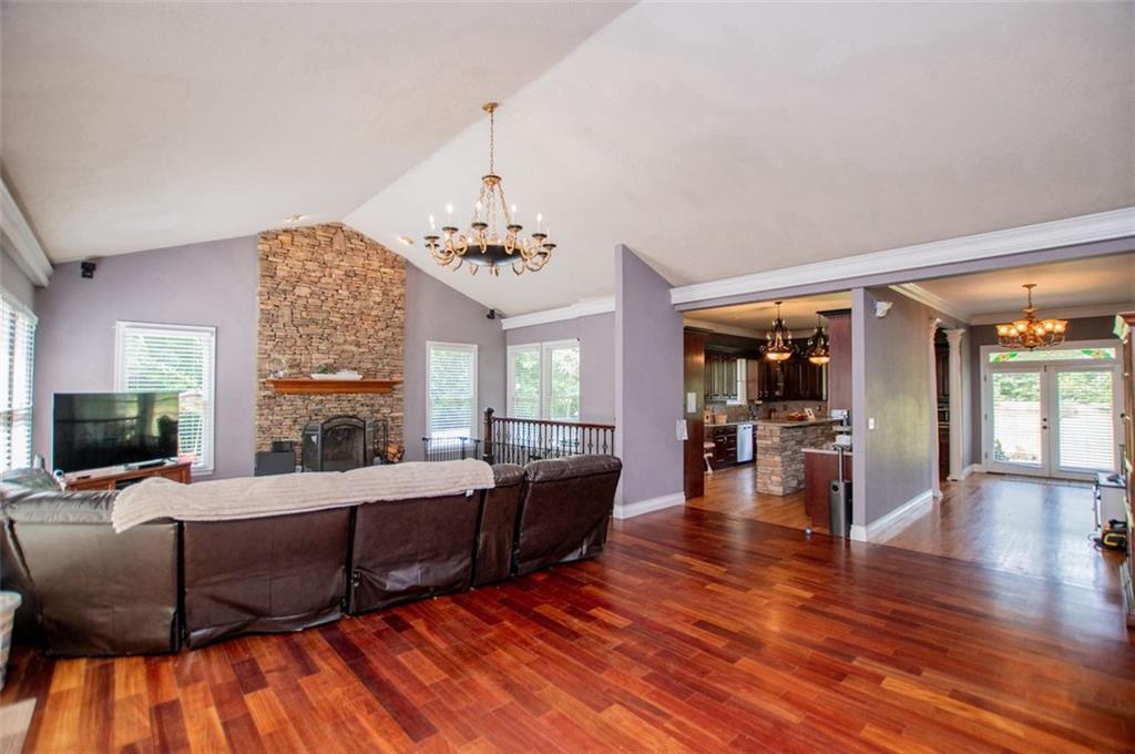 6919 Mt Zion Road Waco, GA 30182 - Photo 45 of 79 a living room with furniture and a chandelier