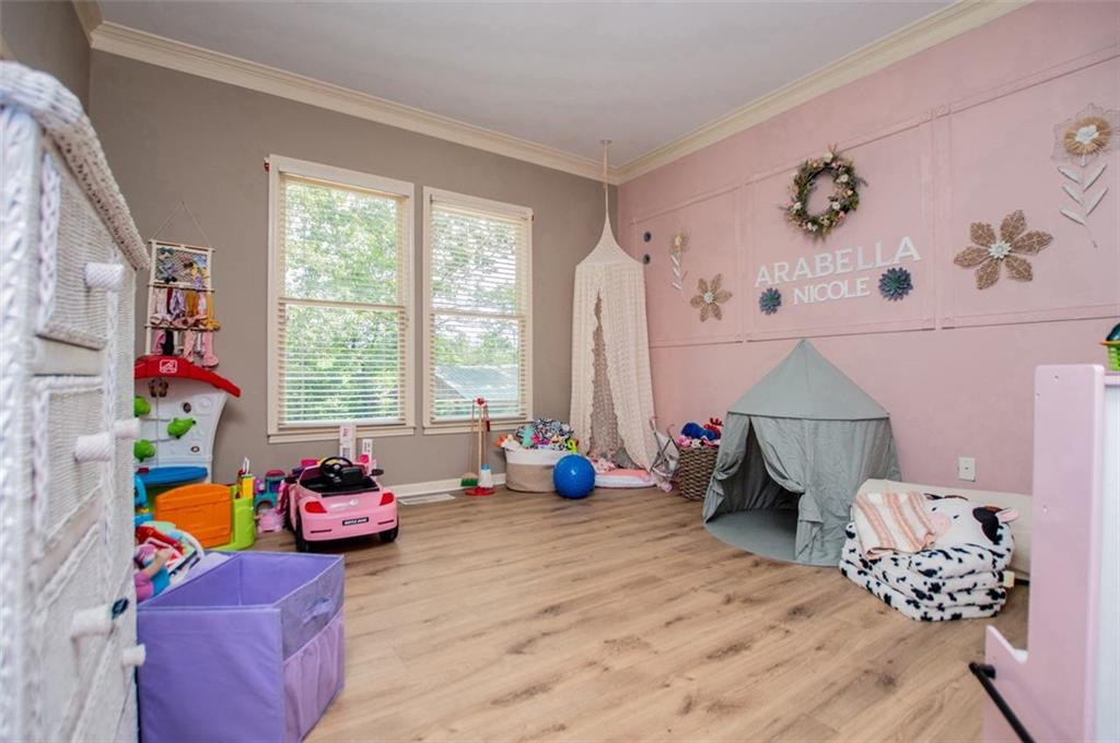 6919 Mt Zion Road Waco, GA 30182 - Photo 54 of 79 a bedroom with furniture and a window