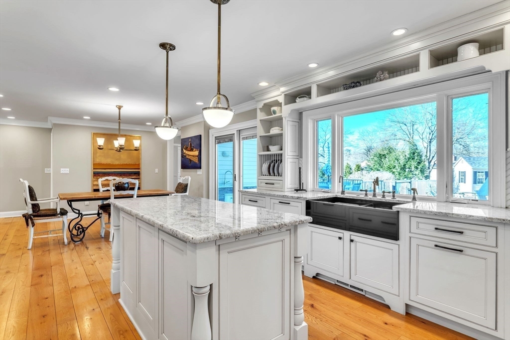 84 Willow Brook Road Longmeadow, MA 01106 - Photo 11 of 42 a kitchen with a sink stove and wooden floor