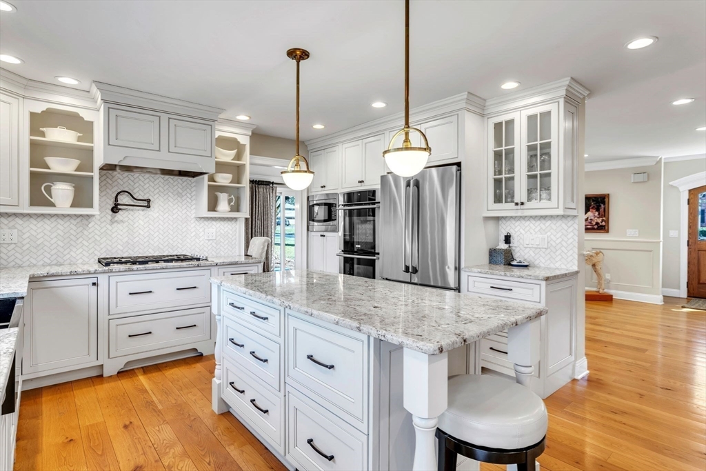 84 Willow Brook Road Longmeadow, MA 01106 - Photo 13 of 42 a kitchen with stainless steel appliances granite countertop a sink refrigerator and cabinets