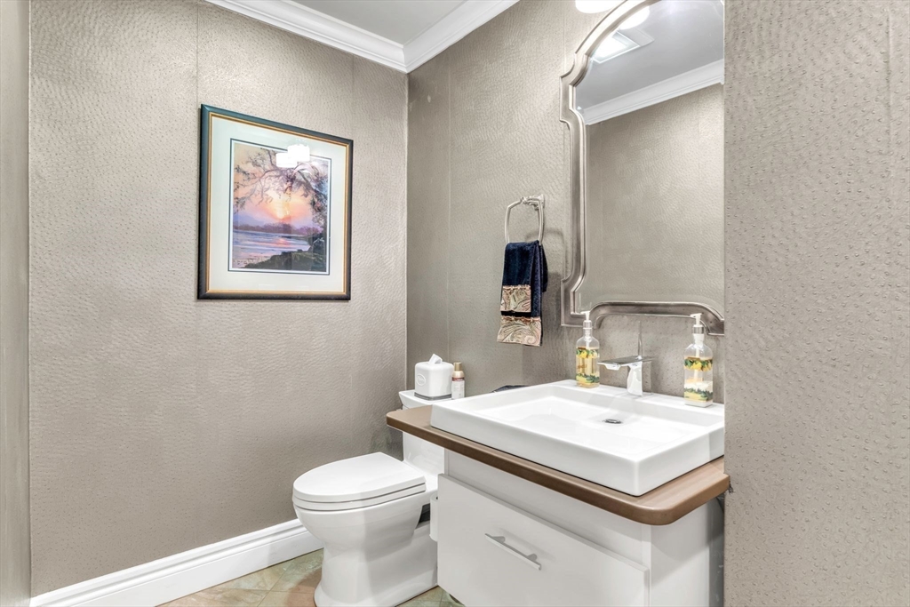 84 Willow Brook Road Longmeadow, MA 01106 - Photo 18 of 42 a bathroom with a toilet sink and mirror