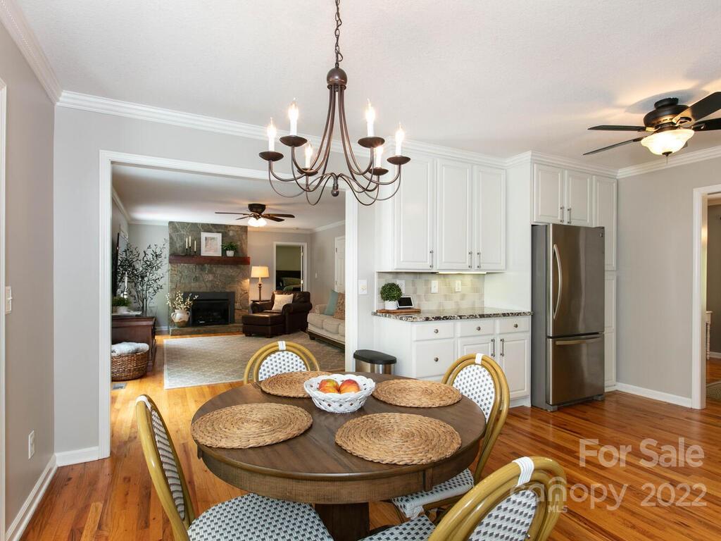 15 Devonshire Drive Candler, NC 28715 - Photo 13 of 43 a kitchen with stainless steel appliances granite countertop a dining table and chairs