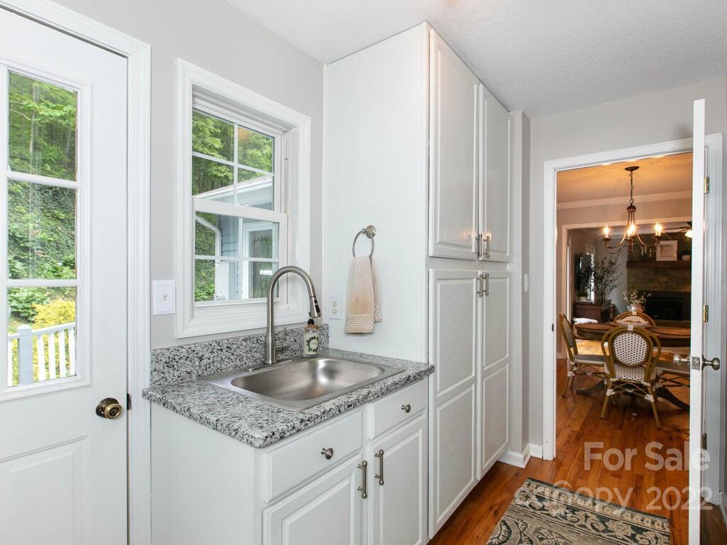 15 Devonshire Drive Candler, NC 28715 - Photo 16 of 43 a kitchen with a sink and a refrigerator