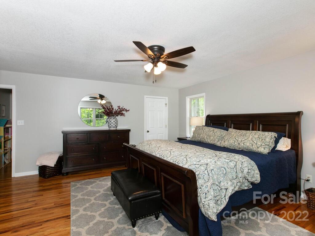 15 Devonshire Drive Candler, NC 28715 - Photo 19 of 43 a bedroom with a bed and a dresser