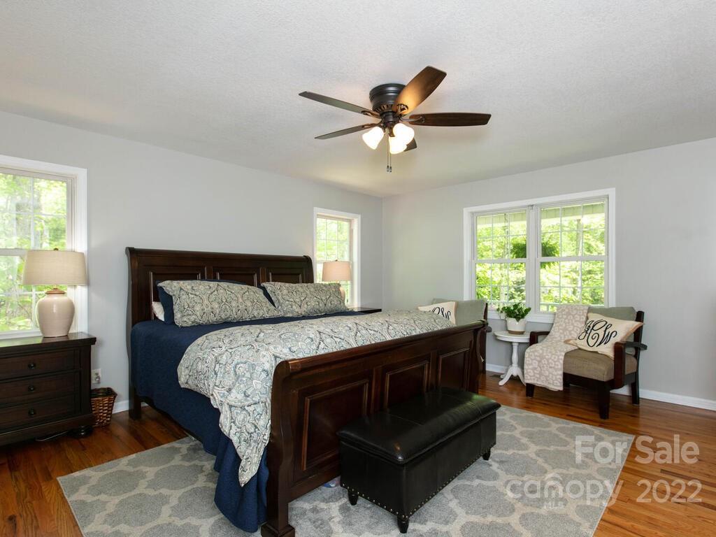 15 Devonshire Drive Candler, NC 28715 - Photo 20 of 43 a bed room with a bed and a chair