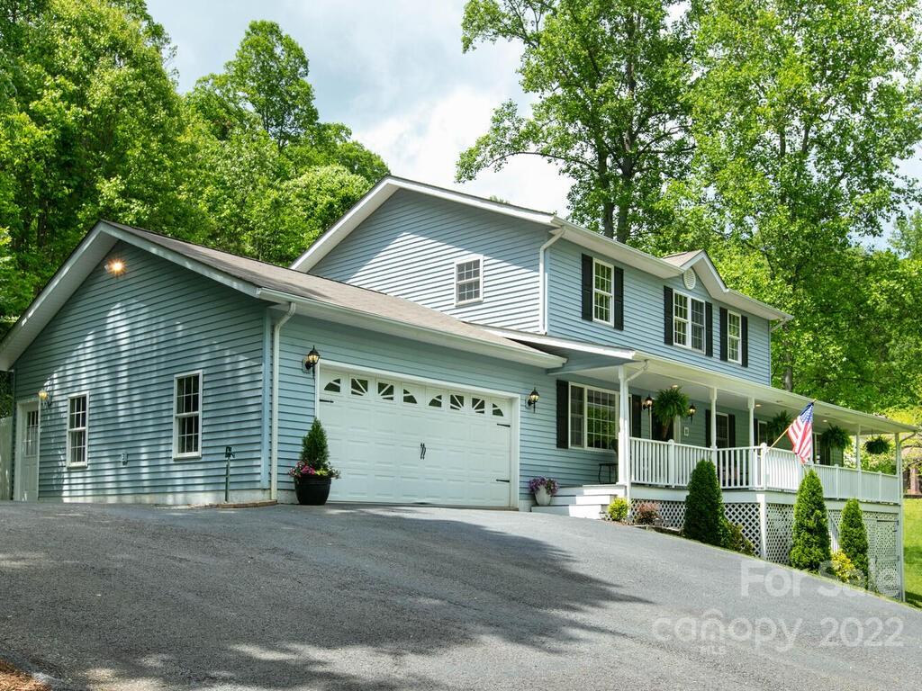 15 Devonshire Drive Candler, NC 28715 - Photo 2 of 43 a view of a house with a yard and plants