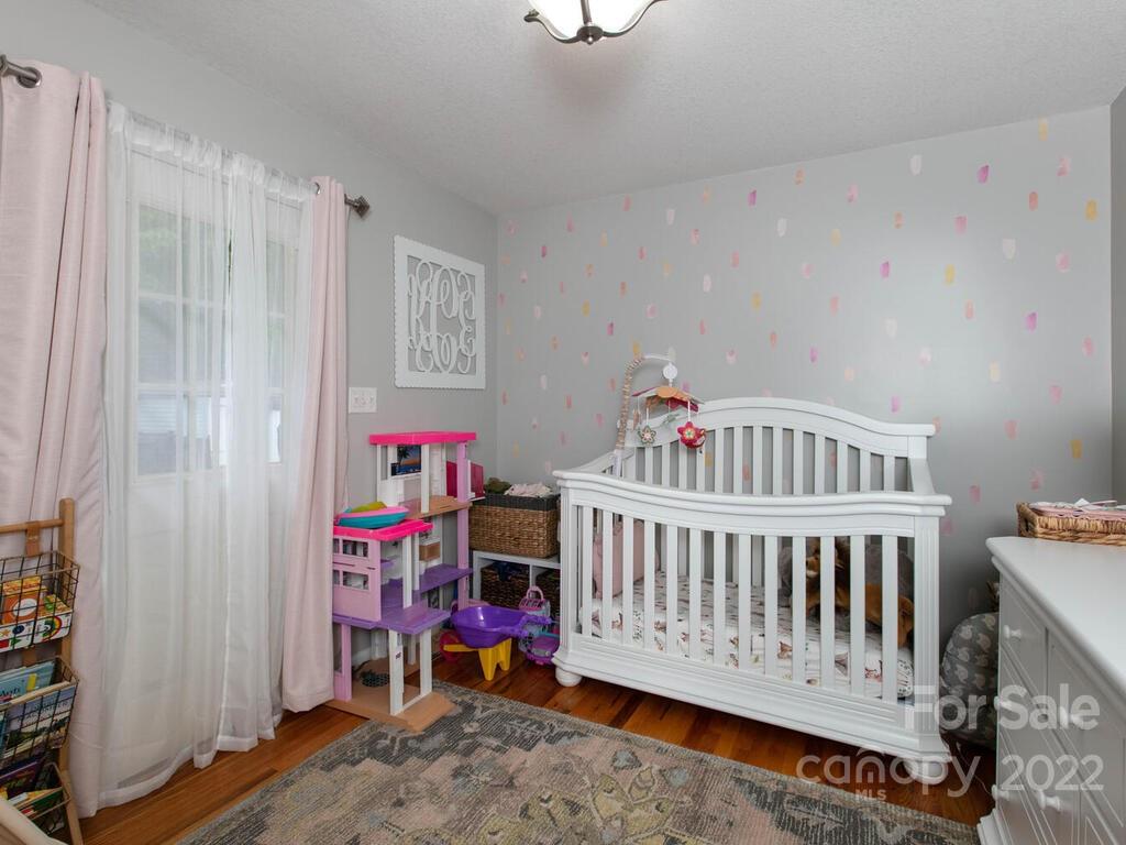 15 Devonshire Drive Candler, NC 28715 - Photo 22 of 43 a view of a bedroom with baby crib