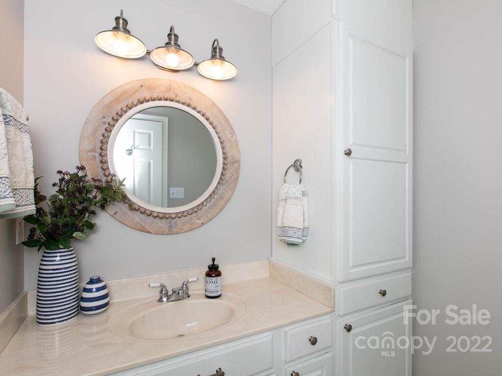15 Devonshire Drive Candler, NC 28715 - Photo 30 of 43 a bathroom with a sink and a mirror